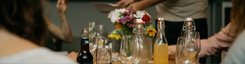 Gallery – table with bottles and flowers